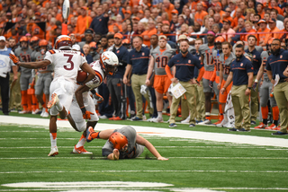 Syracuse long snapper Matt Keller falls to the ground during a special teams play. Keller and SU's special teams looked better from its early season showings.  