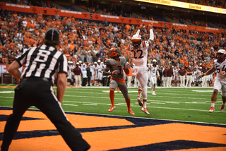 Philips turns around as Terrell Edmunds leaps for an interception. The only blemish on Dungey's day was an interception he threw as Syracuse was driving in the red zone. 