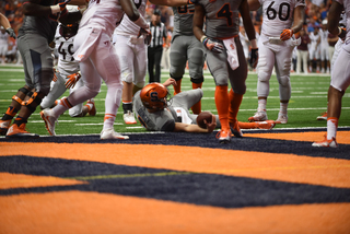 The Syracuse quarterback reaches his hand across the Syracuse goal line. He scored one rushing touchdown against the Hokies. 