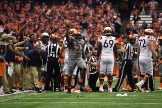 De'Jon Wilson comes up with a fumble as the Syracuse sideline celebrates. After tallying a half sack in the previous six games, Wilson had one sack and one quarterback hurry against the Hokies. 
