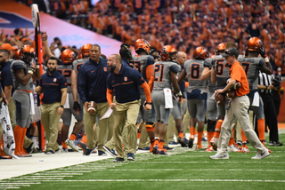 Edinger yells in celebration as the Syracuse offense prepares to get back on the field. SU's win marks the staff's third win at Syracuse. 